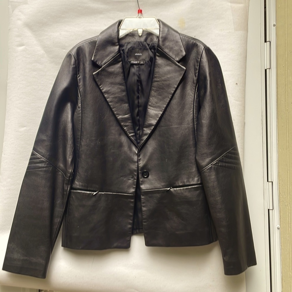 Black leather jacket by identify made in Canada